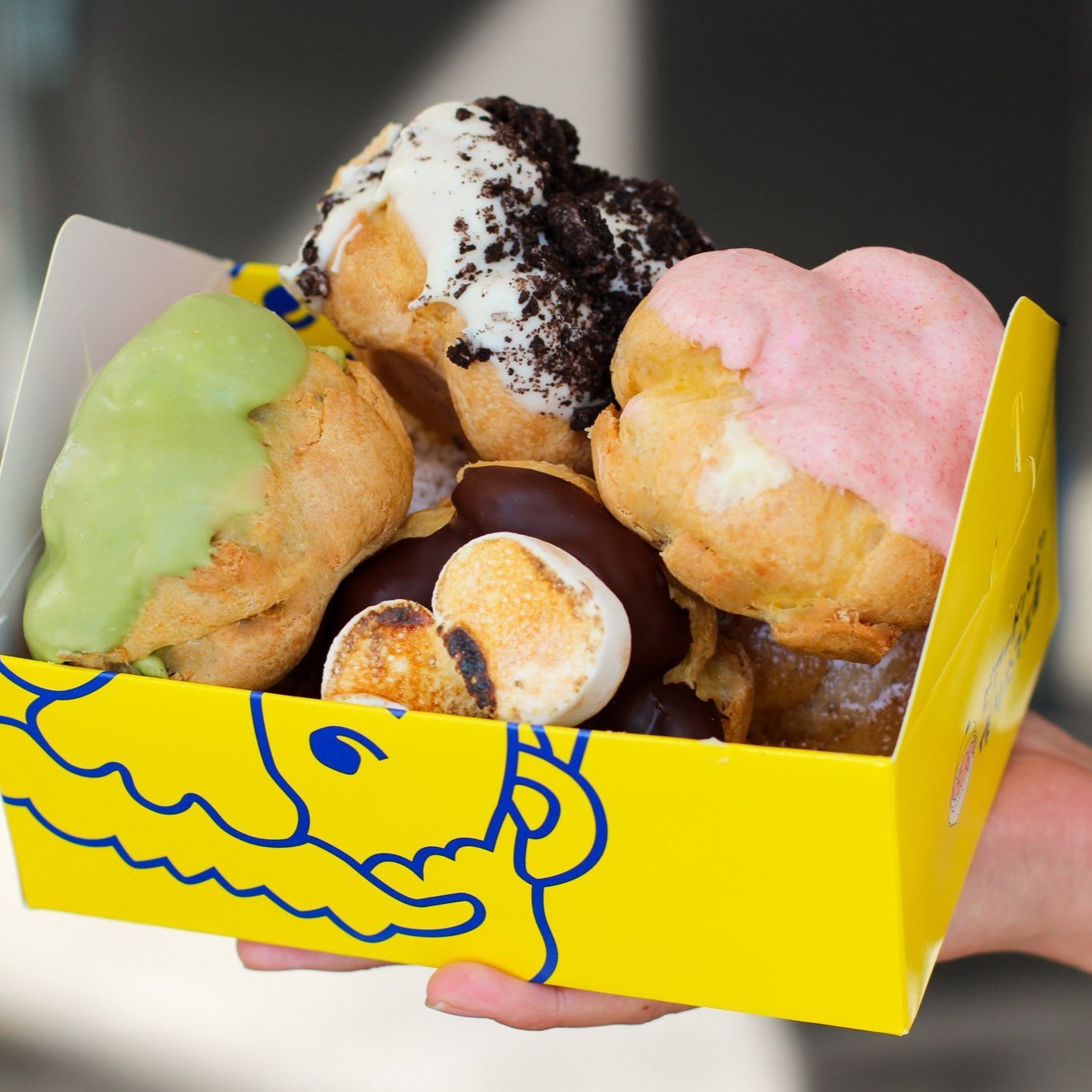 A box of assorted Beard Papa’s cream puffs